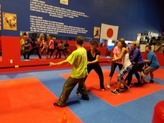 Cardio students finishing a workout