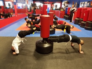 Young karate students practicing together