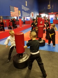 Kids karate instruction in progress