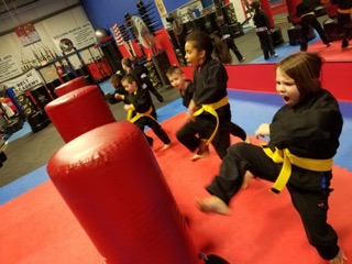 Youth karate students training together