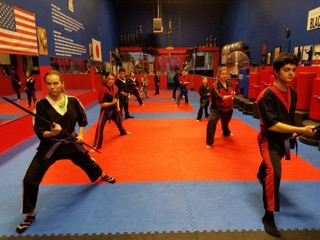 Children practicing karate together