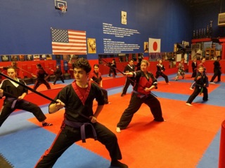 Youth karate students training on the mat