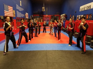 Kids practicing martial arts drills