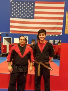 Two martial arts students posing after training